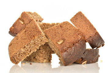 Slices of black cereal bread, close-up, on a white background.