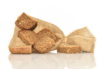 Slices of black cereal bread, close-up, on a white background.