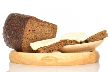 Slices of black cereal bread, close-up, on a white background.