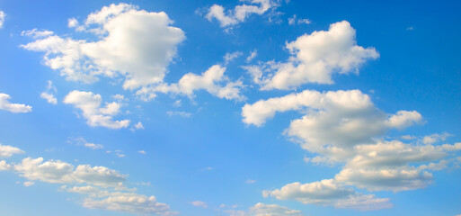 Obraz premium Cumulus clouds in the blue sky . Wide photo