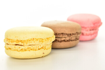 Tasty multi-colored, sweet macaroons, on a white background.