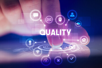 Finger touching tablet with web technology icons and QUALITY inscription, web technology concept