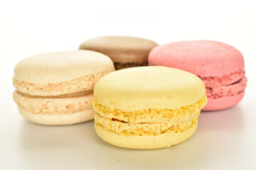 Tasty multi-colored, sweet macaroons, on a white background.