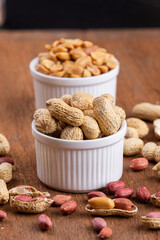 Dried peanuts on wood background