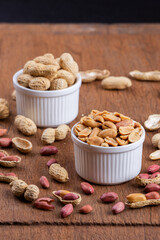 Dried peanuts on wood background