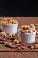 Dried peanuts on wood background