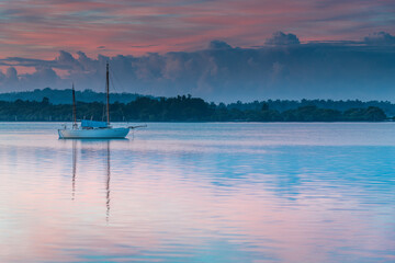 Sunrise Waterscape with High Cloud and Boat