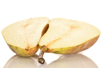 Ripe organic pears, close-up, on a white wooden table.