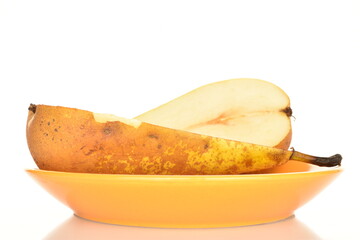 Ripe organic pears, close-up, on a white wooden table.