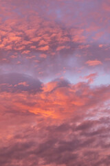 Epic dramatic sunrise, sunset pink violet orange sky with clouds background texture	