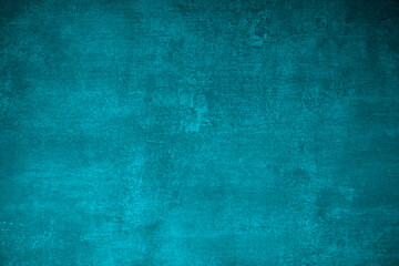 Detail of a grunge wall in a light blue tint