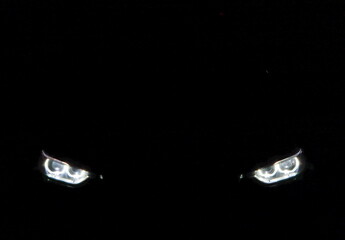 headlight led ray of the sports luxury bmw  series 3 car f30 model park in the dark garage for checking maintance  - obrazy, fototapety, plakaty
