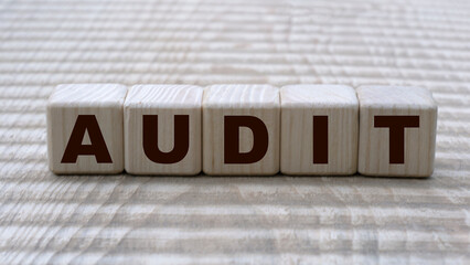 concept of the word AUDIT on cubes on a beautiful background