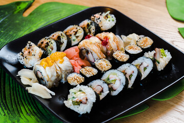 Sushi and roll set on wooden table. Selective focus