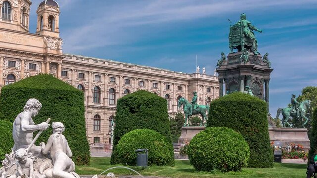Empress Maria Theresia Monument timelapse and Art History Museum with fountain on foreground in Vienna, Austria. Beautiful view of famous Naturhistorisches Museum (Natural History Museum) with park