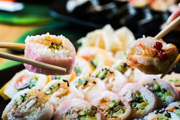 Sushi and roll set on wooden table. Selective focus