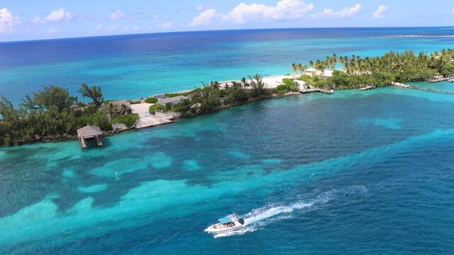 Perfect blue water, with a boat sail trough in Bahamas