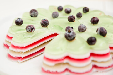 Jelly cake with blueberries. Striped and sweet dessert.