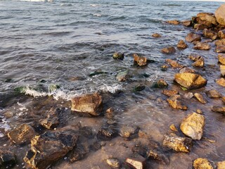 Sea foam and rocks on the beach 