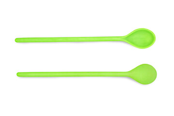 Green plastic spoon isolated on white background with clipping path.