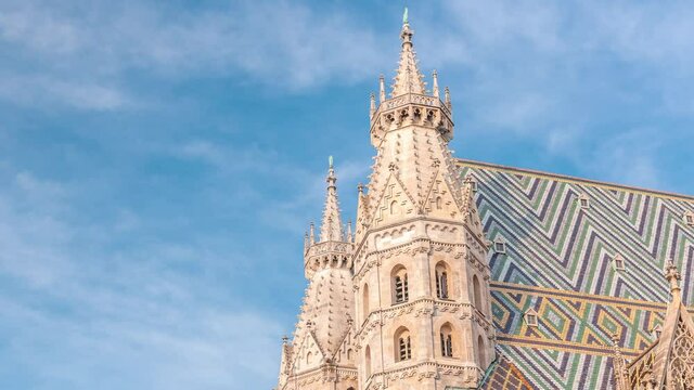 Top of St. Stephen's Cathedral timelapse (Stephansdom, Domkirche St. Stephan), the mother church of Roman Catholic Archdiocese of Vienna and one of the tallest churches in the world, Stephansplatz