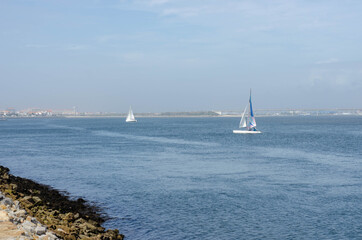 Little boats on a shore of Costa Nova in a water