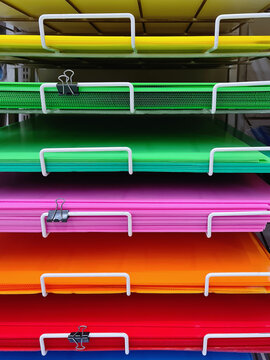 Multi-Level of Colorful Plastic Boards on Shelf