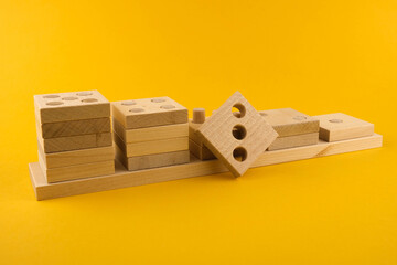 Children's wooden toy sorter. Educational logic toys for kid's close-up. Montessori Games for child development