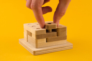 Children's wooden toy sorter. Educational logic toys for kid's close-up. Montessori Games for child development