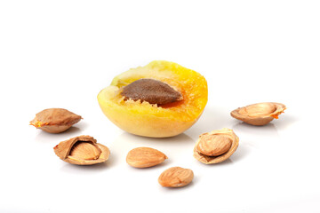 Half of and kernels apricot isolated on white background