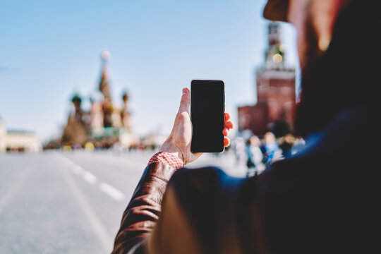 Tourist taking picture with smartphone on Red Square