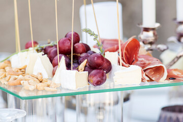 Catering service. Catering food. Table with food at event. Beautifully decorated catering banquet table with different food snacks and appetizers with sandwich.