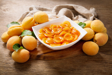 bowl of canned apricots and fresh fruits