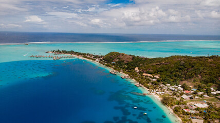 Fototapeta na wymiar aerial view upon tropical island with resort on sea