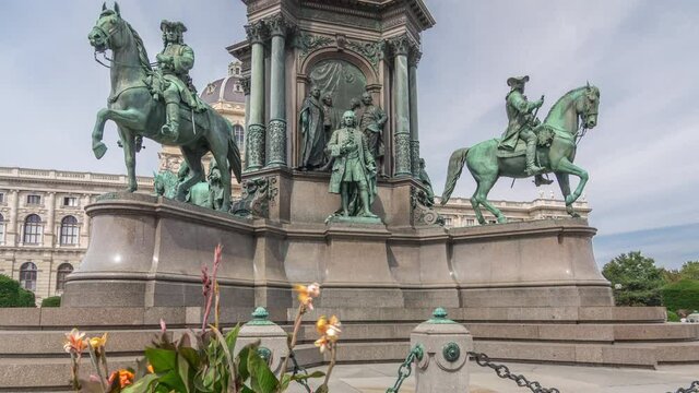 Empress Maria Theresia Monument timelapse hyperlapse and Art History Museum in Vienna, Austria. Beautiful view of famous Naturhistorisches Museum (Natural History Museum) with park and sculpture in