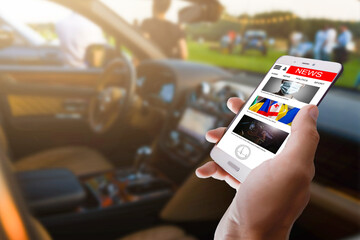 Close-up Of A Woman's Hand Reading News On Mobile Phone