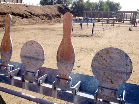 Metal targets at shooting range outdoor firearm rifle shotgun practice sunny