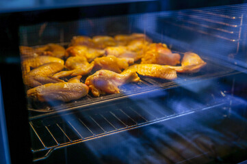 Chicken wings in the oven with evening light