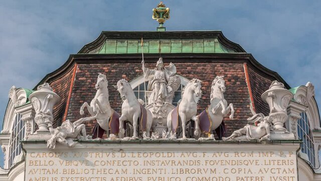 Sculptures at The Austrian National Library entrance timelapse, Josefsplatz, Vienna, Austria. Blue cloudy sky
