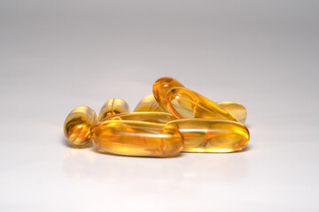 fish oil capsules on a white background