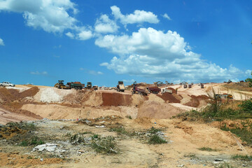 KUALA LUMPUR, MALAYSIA -JULY 17, 2019: Heavy machinery doing the soil backfilling work at the construction site. Works carried out before building construction starts to get the required levels. 
