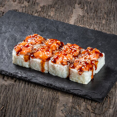 Japanese cuisine. Seafood, vegetables and meat. Sushi and rolls big set isolation on a wooden table background