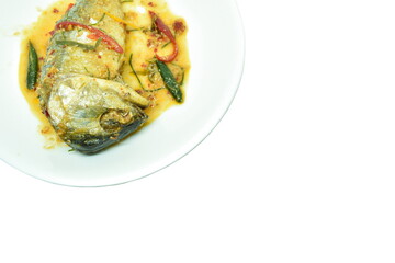 spicy fried mackerel fish with chili and curry on plate