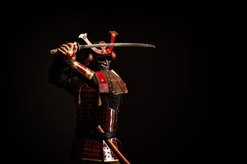 Portrait of a samurai in armor in attack position