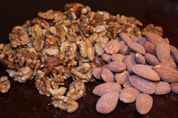 Closeup shot of  a salted almonds and walnuts