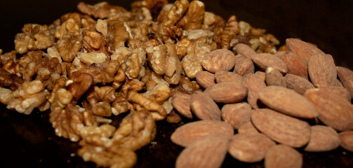 Closeup shot of  a salted almonds and walnuts