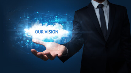 Hand of Businessman holding OUR VISION inscription, successful business concept