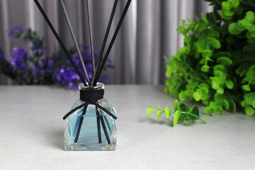 The luxury scented aroma room fresherner reed diffser glass bottle with black fiber sticks in the...