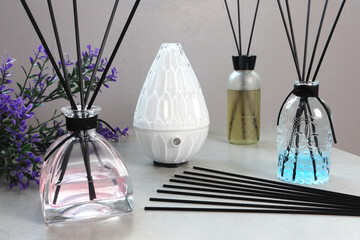 The luxury scented aroma room fresherner reed diffser glass bottle with black fiber sticks in the...