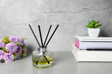 The luxury scented aroma room fresherner reed diffser glass bottle with black fiber sticks in the...